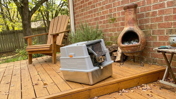 Furrbby Flip Door Hooded Stainless Steel Litter Box, Rustproof Anti-Leak Cat Toilet Placed on Backyard Wooden Deck